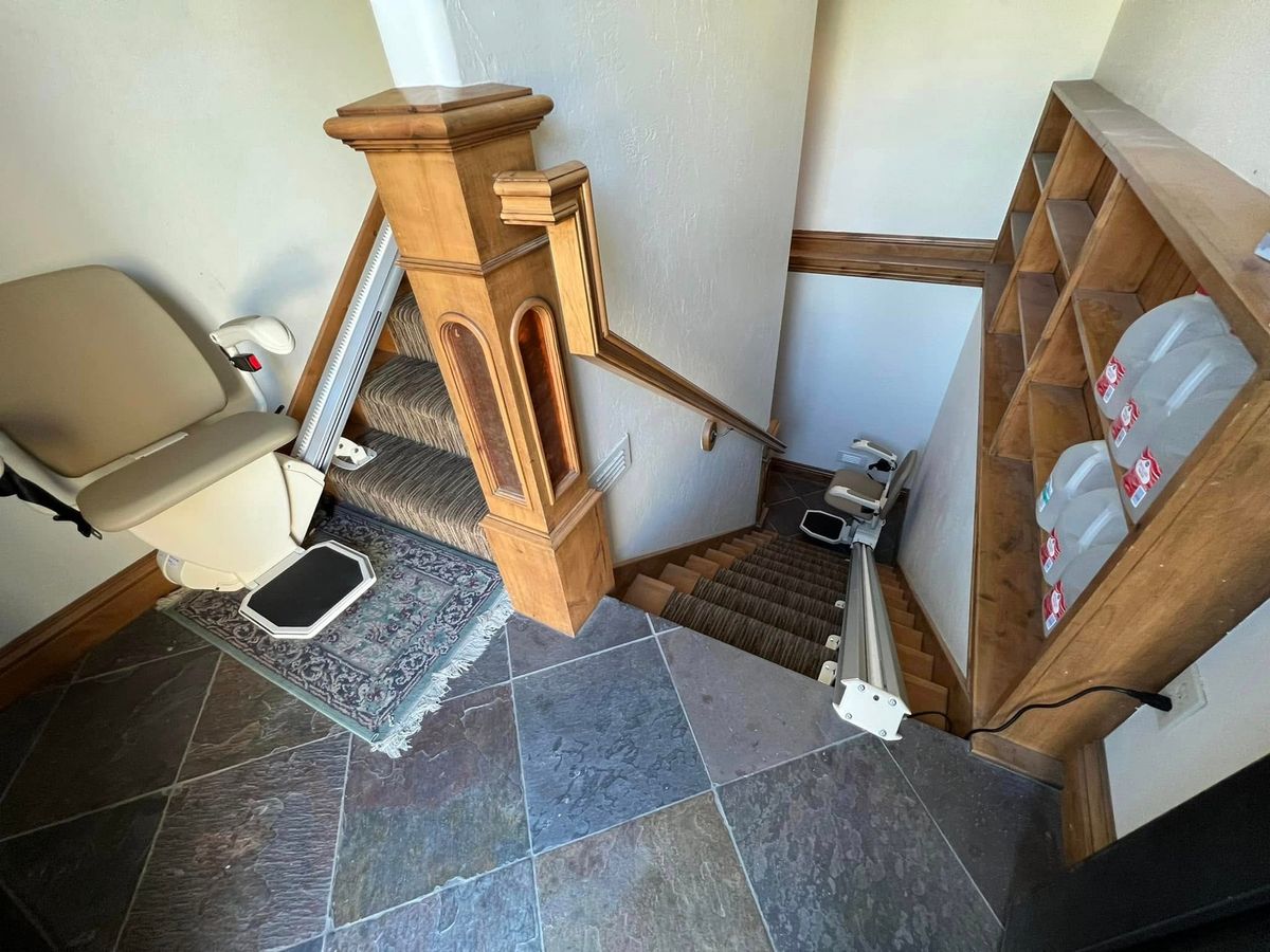 Lazo install: slate entry with a folded lift and a second rail to the basement